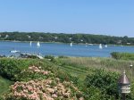 Watch the sailboats float by on Town Cove from this lush property 